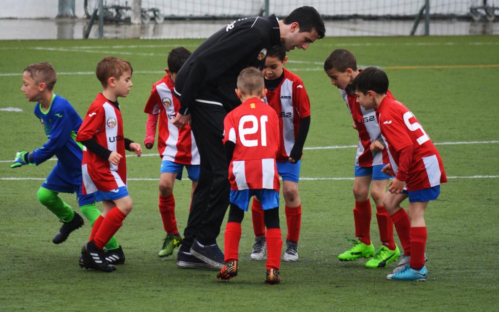 Coach and elementary aged soccer players